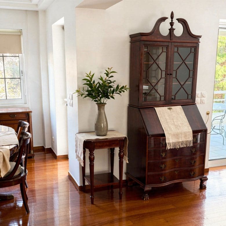 Dining room corner with wooden cabinet and balcony door, Voula, Athens Riviera, Greece
