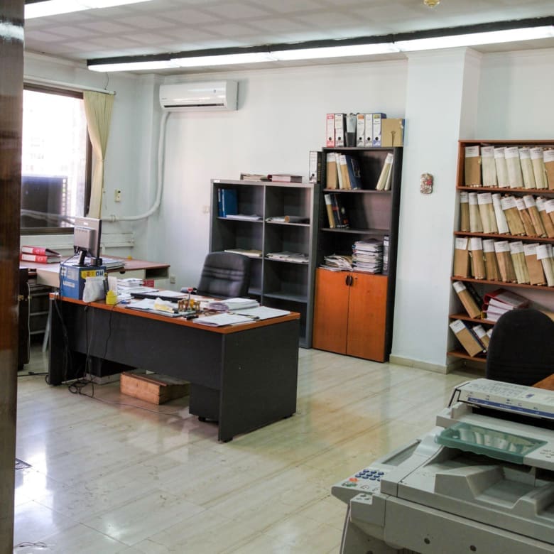 Office interior with desk, shelving, and document storage, Piraeus, Greece