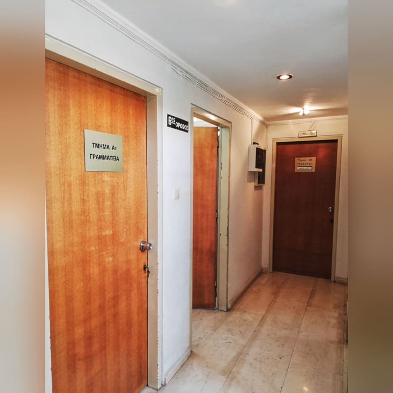 Interior corridor with doors and simple finishes, Piraeus, Greece