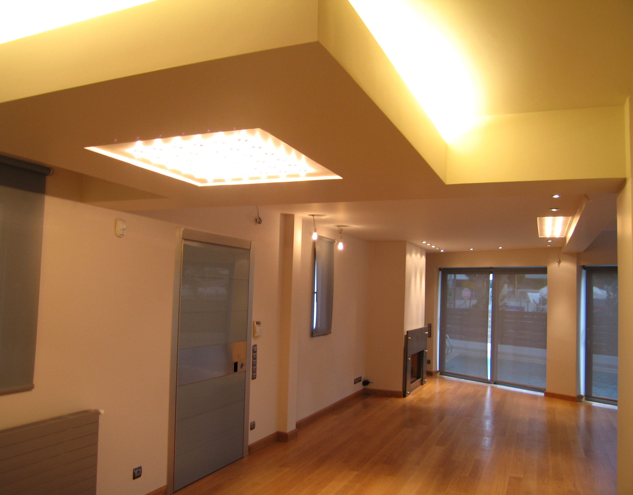 Upper-level hallway with recessed lighting at a private villa in Alimos, Athens Riviera