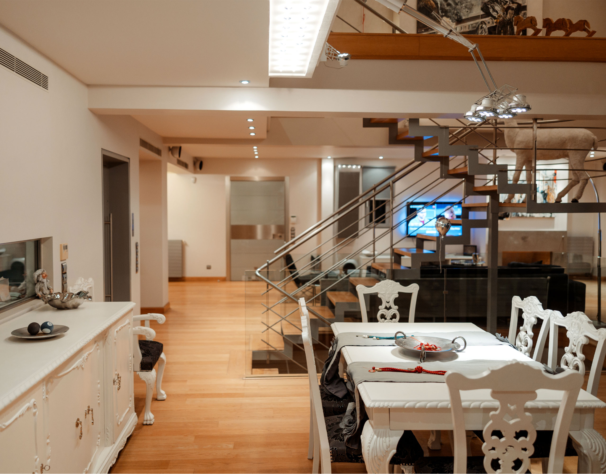 Open-plan kitchen with dining area and modern finishes at a private villa in Alimos, Athens Riviera