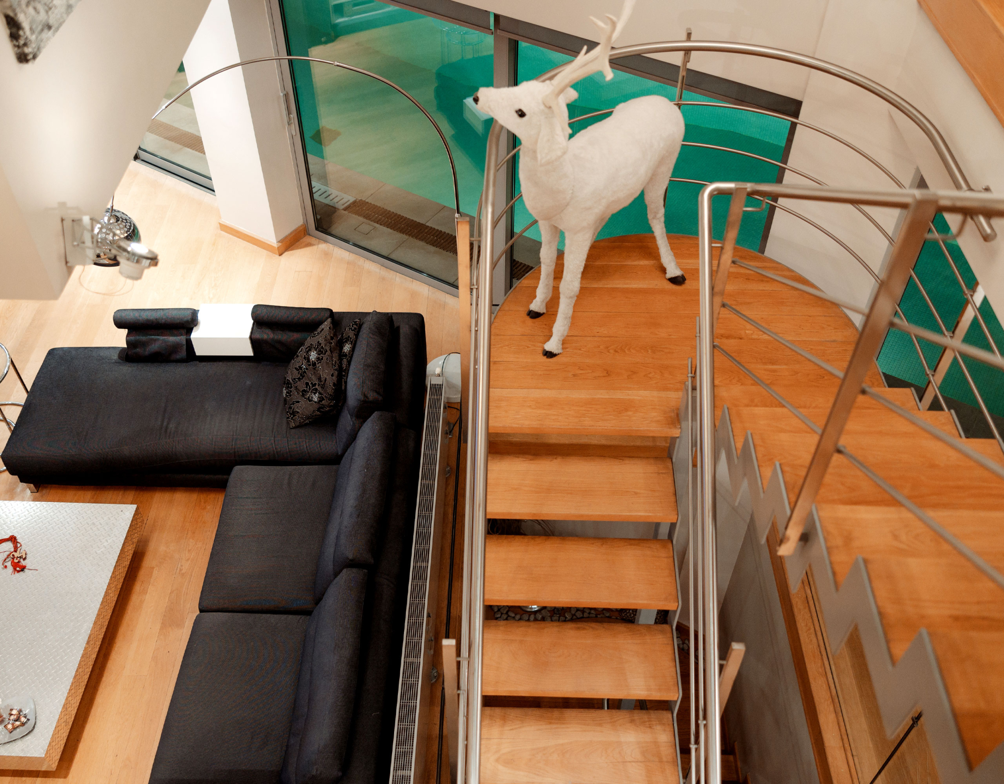Interior staircase with wood steps and modern railing at a private villa in Alimos, Athens Riviera