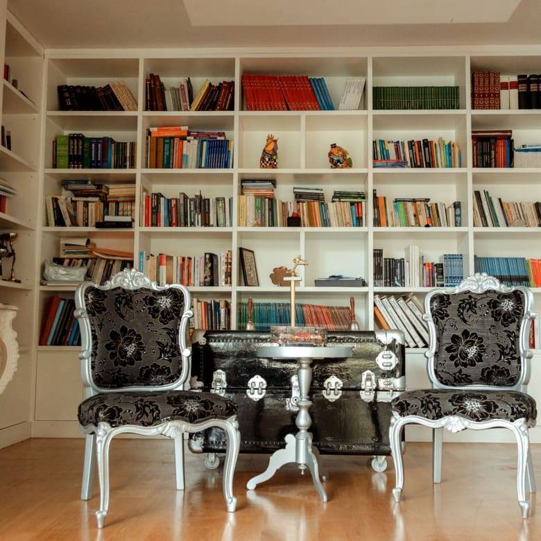 Library-style room with built-in bookshelves at a private villa in Alimos, Athens Riviera