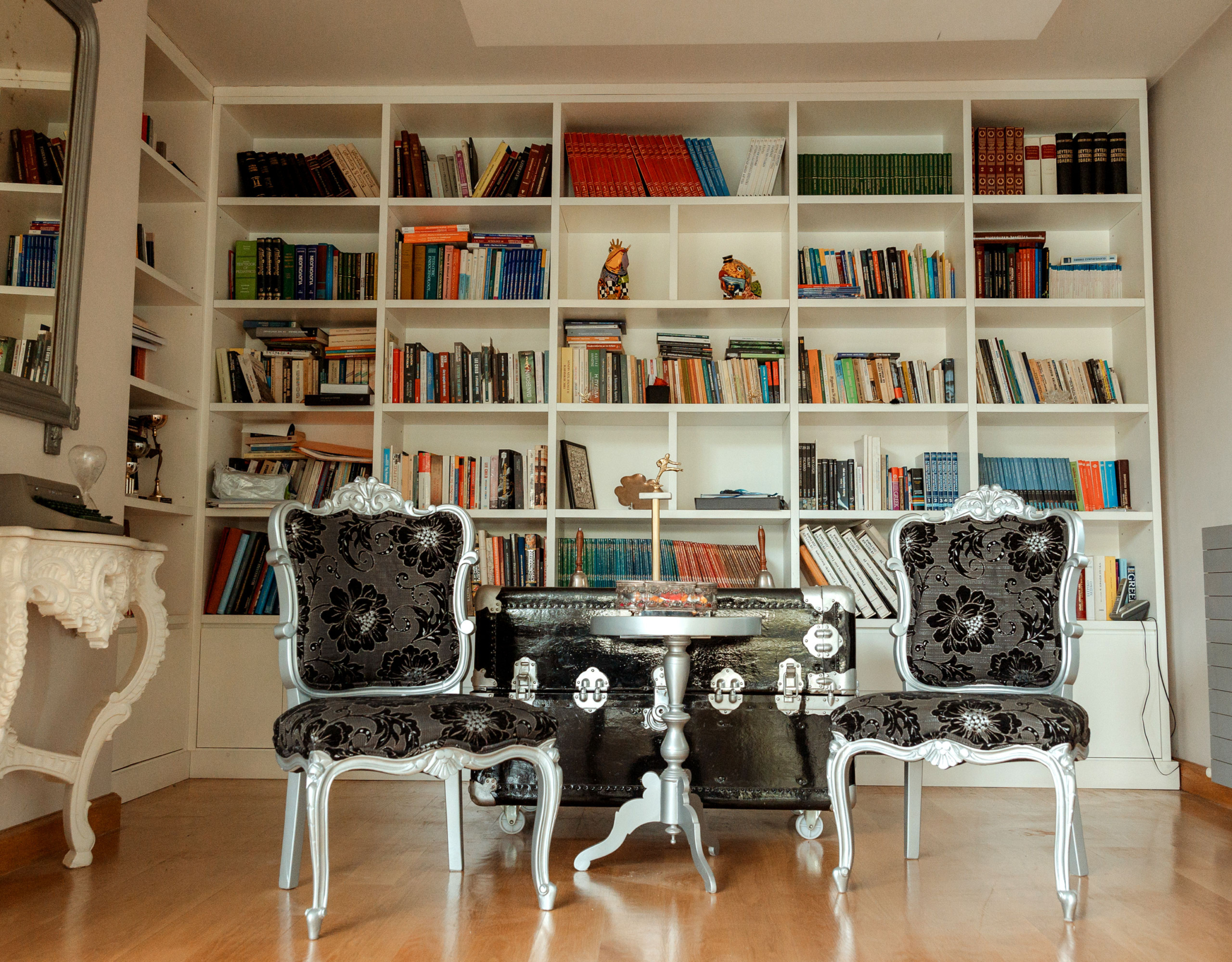 Library-style room with built-in bookshelves at a private villa in Alimos, Athens Riviera