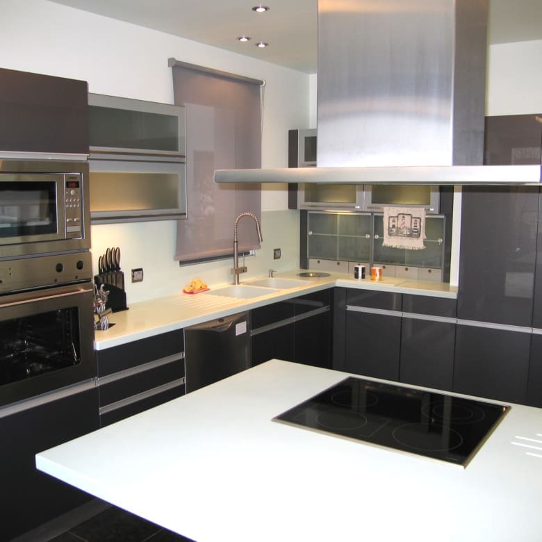 Contemporary kitchen with island and glossy finishes at a private villa in Alimos, Athens Riviera