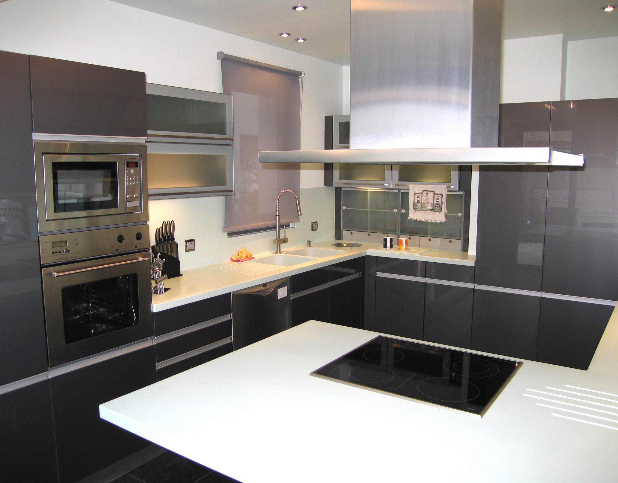 Contemporary kitchen with island and glossy finishes at a private villa in Alimos, Athens Riviera