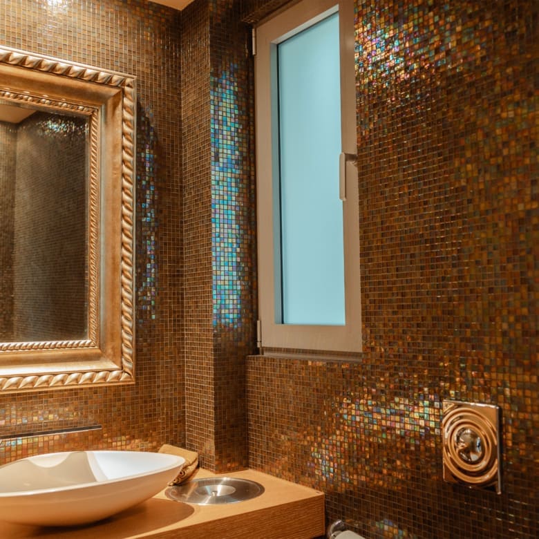 Bathroom with mosaic tile walls and vanity detail at a private villa in Alimos, Athens Riviera