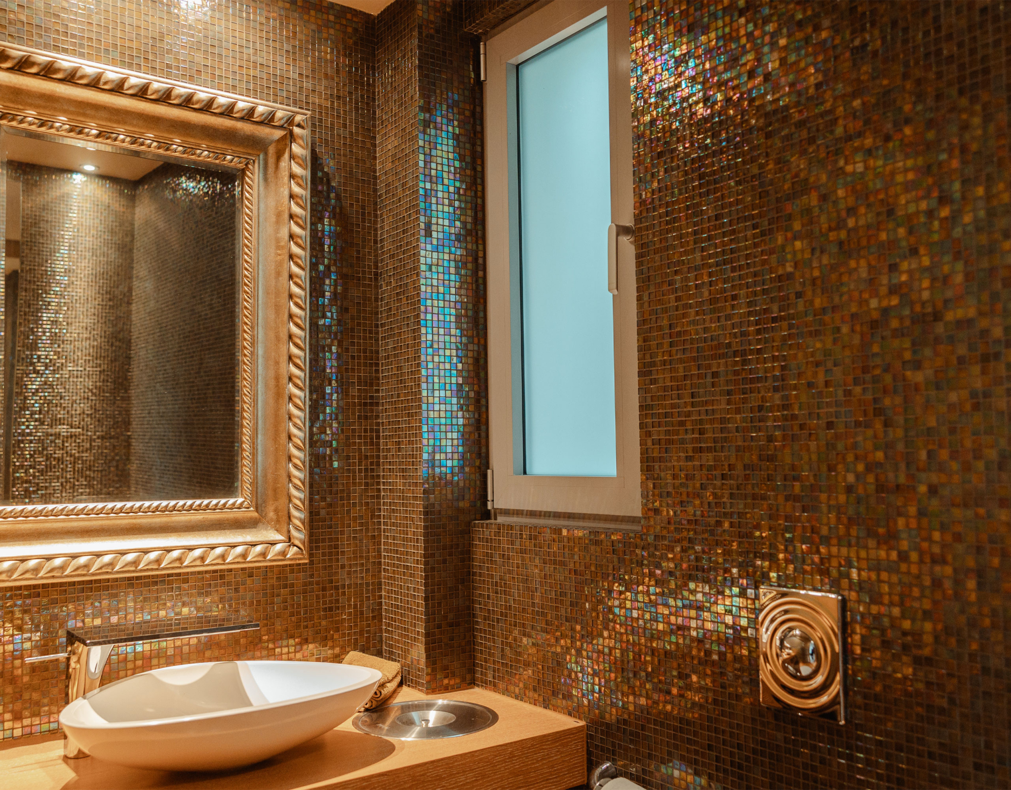 Bathroom with mosaic tile walls and vanity detail at a private villa in Alimos, Athens Riviera