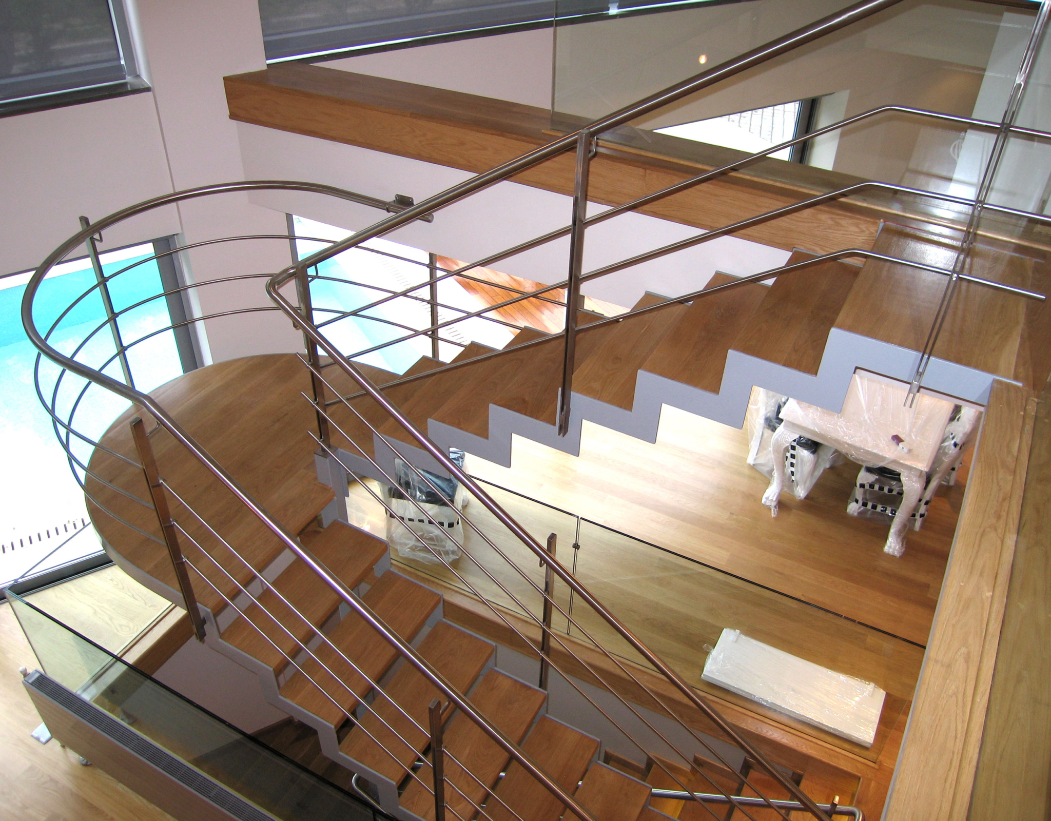 Architectural staircase with mezzanine and open-plan layout at a private villa in Alimos, Athens Riviera