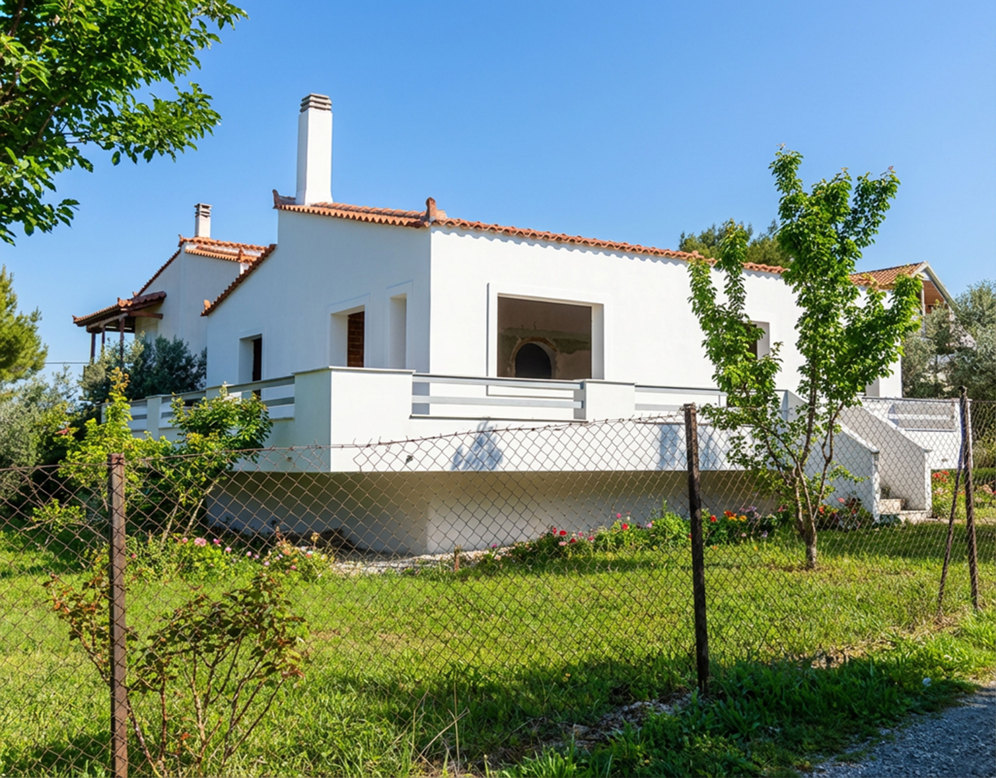 Detached house exterior with garden area and surrounding greenery, Dilesi, Boeotia, Greece