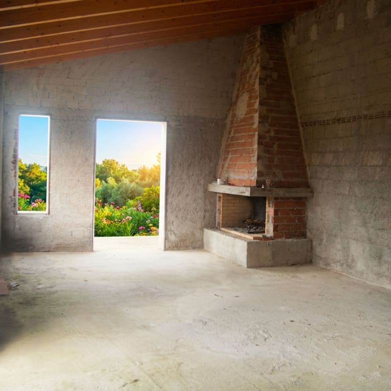Unfinished interior space with built-in fireplace and open doorway to terrace, Dilesi, Boeotia, Greece