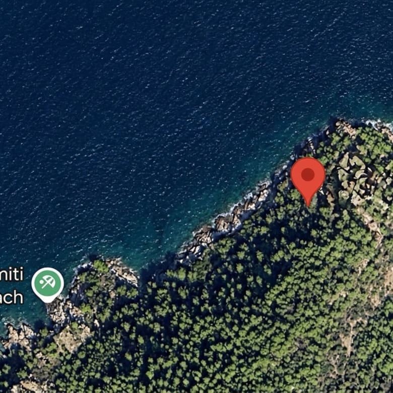 Satellite map view with location pin near Kamini Beach, Hydra, Greece