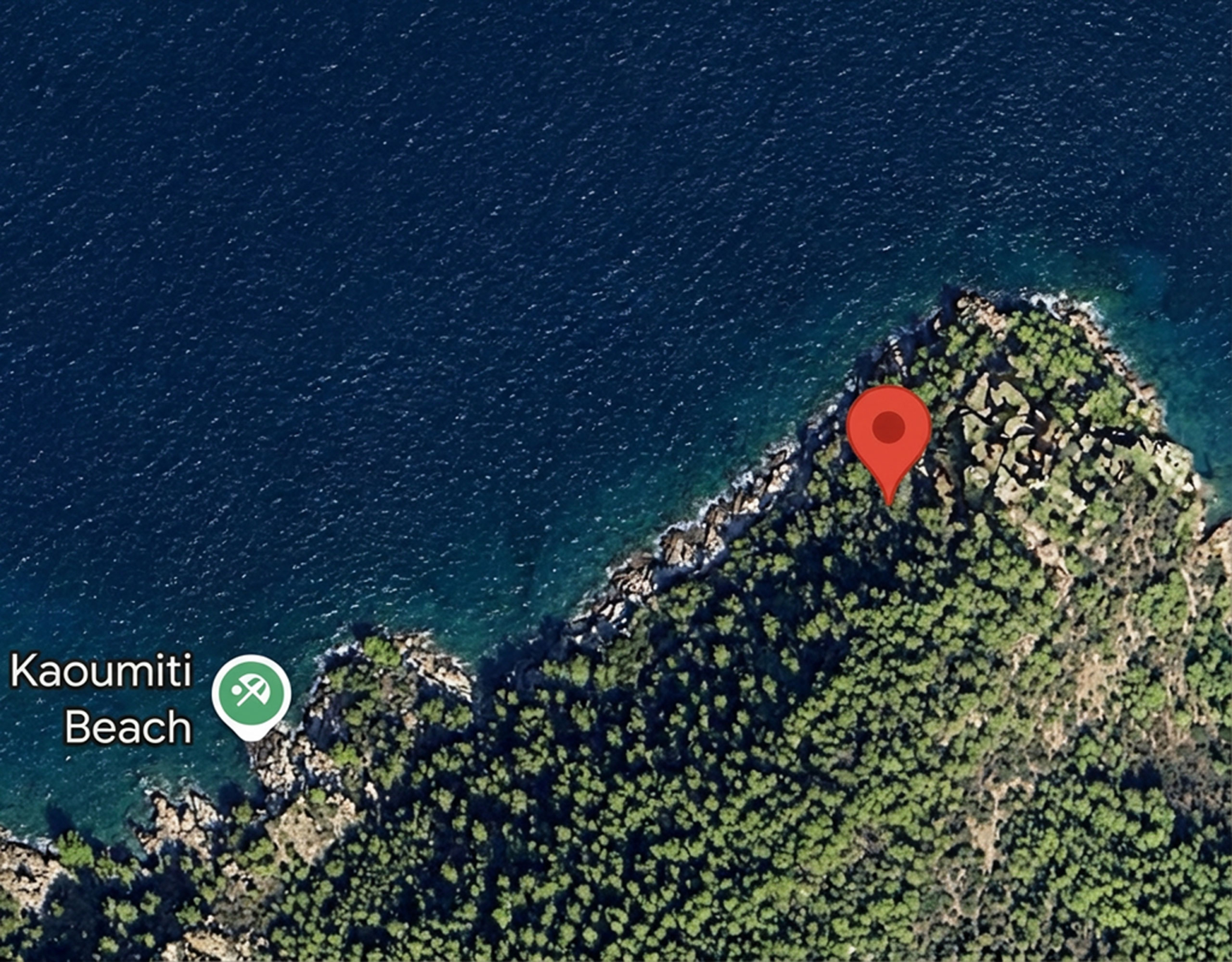 Satellite map view with location pin near Kamini Beach, Hydra, Greece