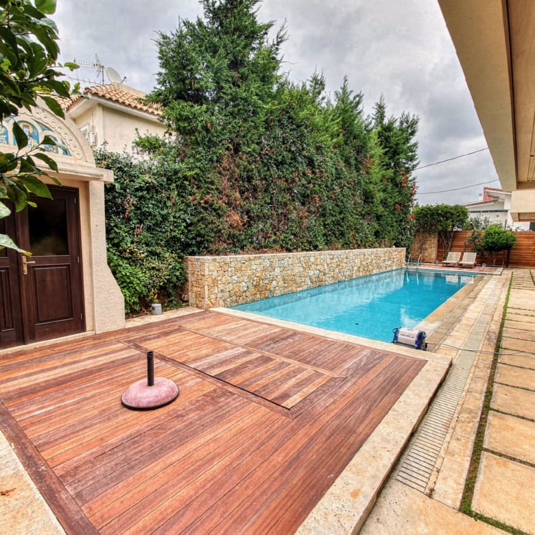 Private pool with outdoor flooring and stone boundary walls, Porto Rafti, Greece