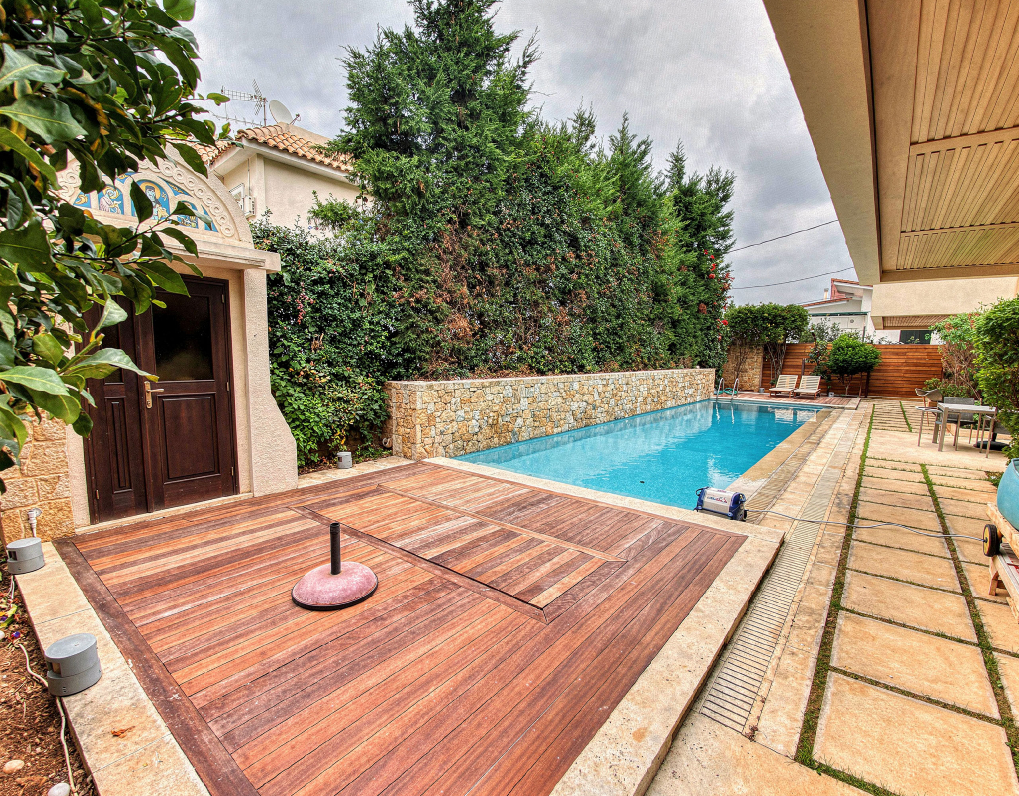 Private pool with outdoor flooring and stone boundary walls, Porto Rafti, Greece