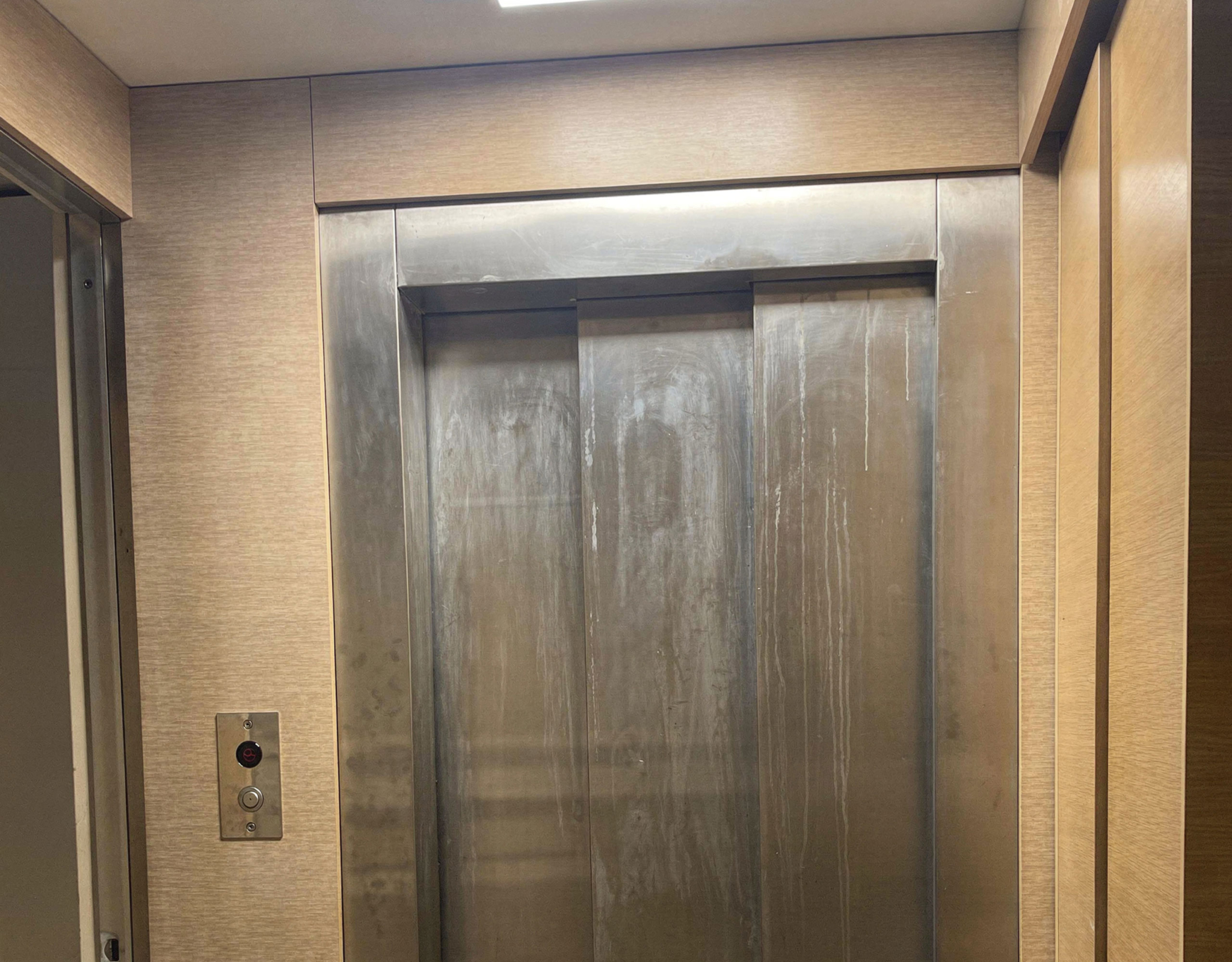 Private elevator interior with metallic doors and control panel, Porto Rafti, Greece