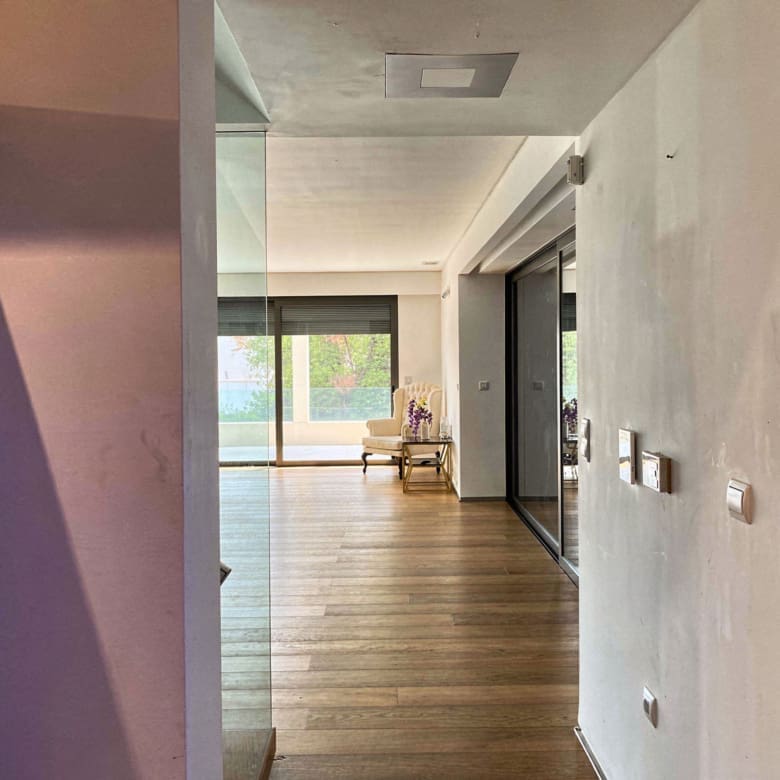 Interior hallway with wood flooring and view toward the living area, Porto Rafti, Greece