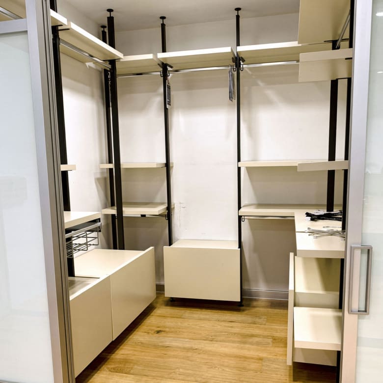 Walk-in closet with open shelving, hanging rails, and wood flooring, Porto Rafti, Greece