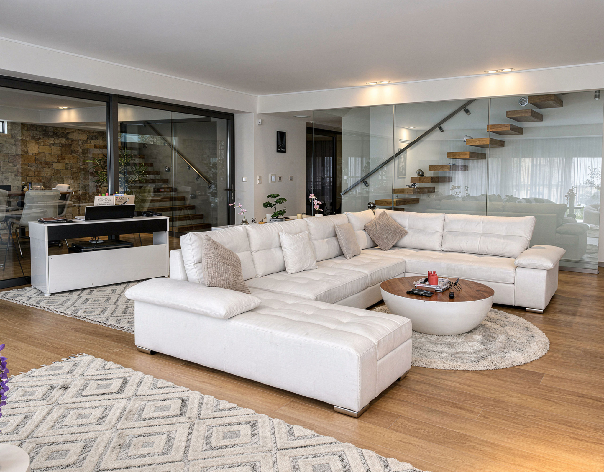 Modern living room with large sectional sofa and open-plan layout, Porto Rafti, Greece