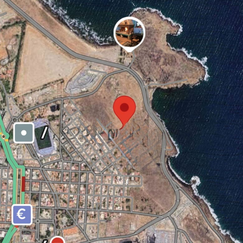 Map view with location pin indicating the coastal land site, Greece
