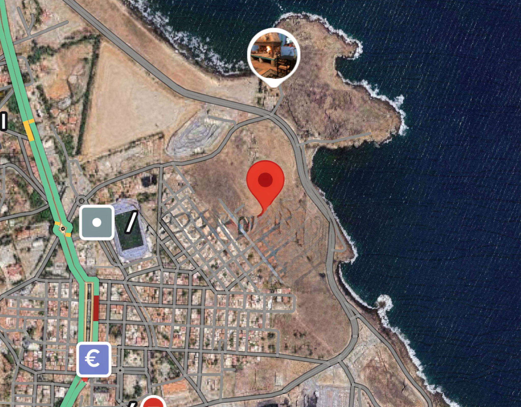 Map view with location pin indicating the coastal land site, Greece