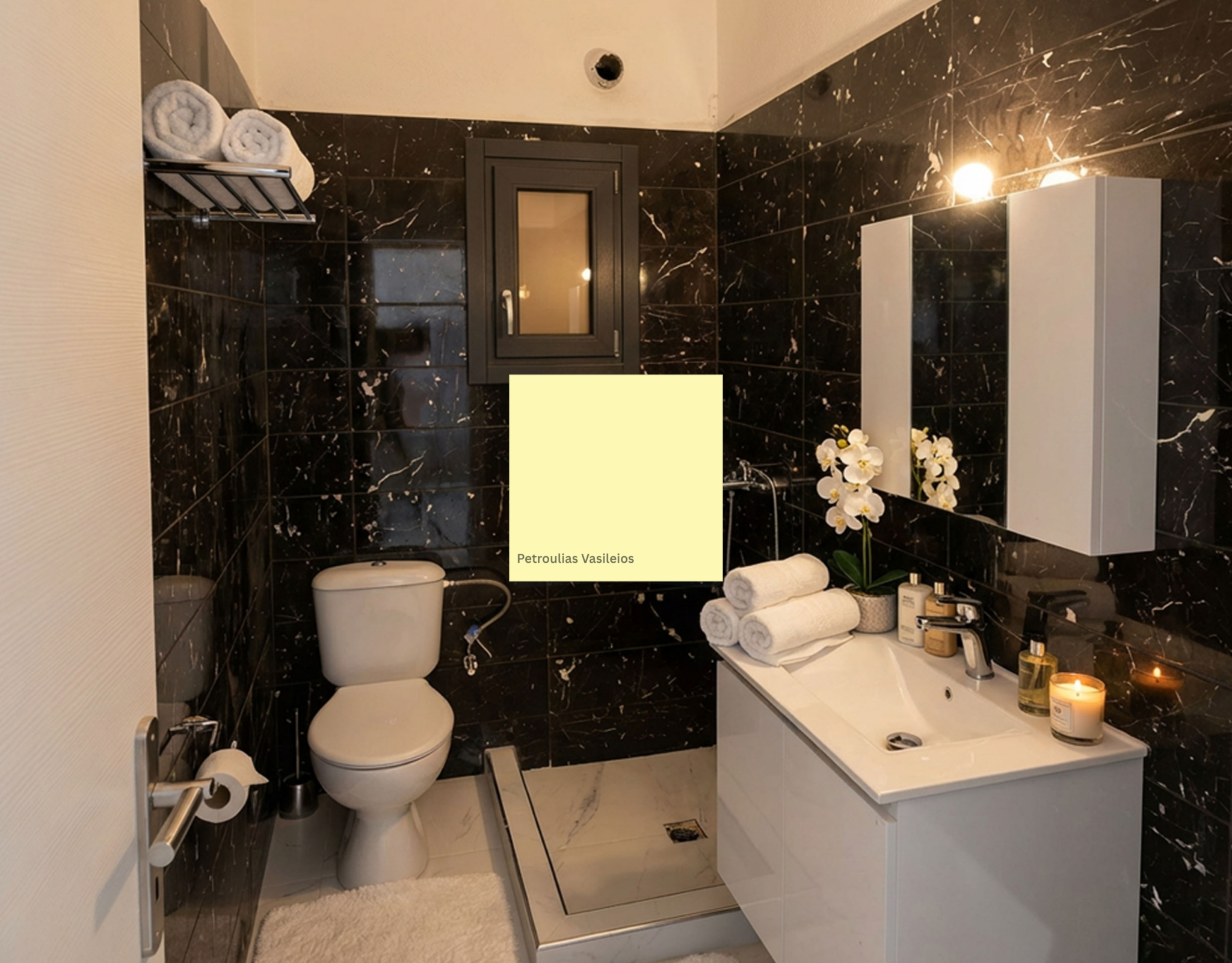 Modern bathroom with dark marble finishes in the Exo Gonia apartment, Santorini