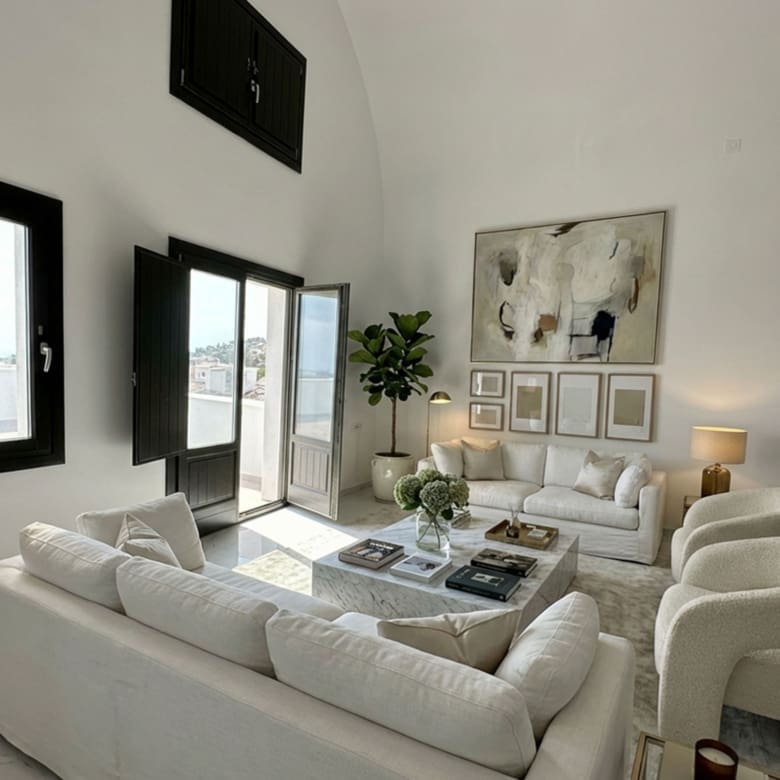 Open-plan living area view in the Exo Gonia apartment, Santorini