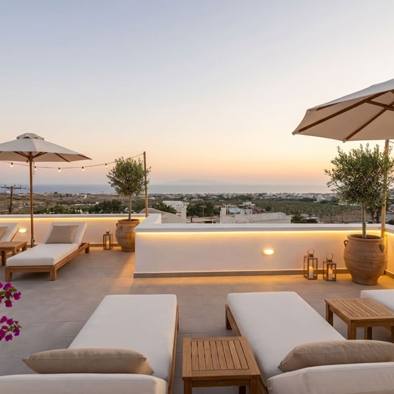 Sea-view terrace at sunset at the Exo Gonia apartment, Santorini