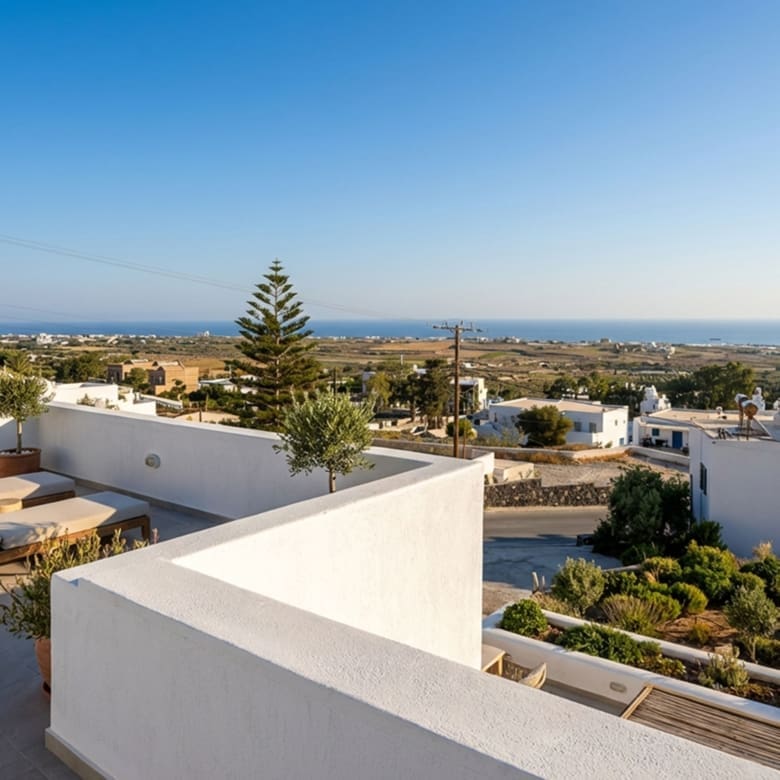 Panoramic sea and village view from the Exo Gonia apartment terrace, Santorini