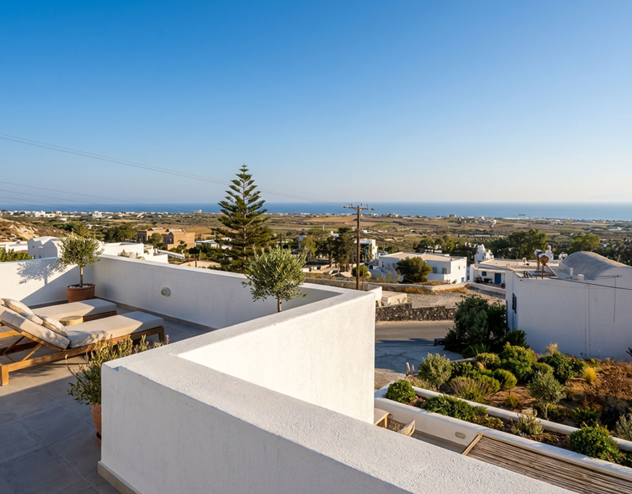 Panoramic sea and village view from the Exo Gonia apartment terrace, Santorini