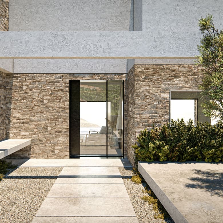 Stone-clad exterior entrance walkway at The Pebble House, Tinos, Cyclades
