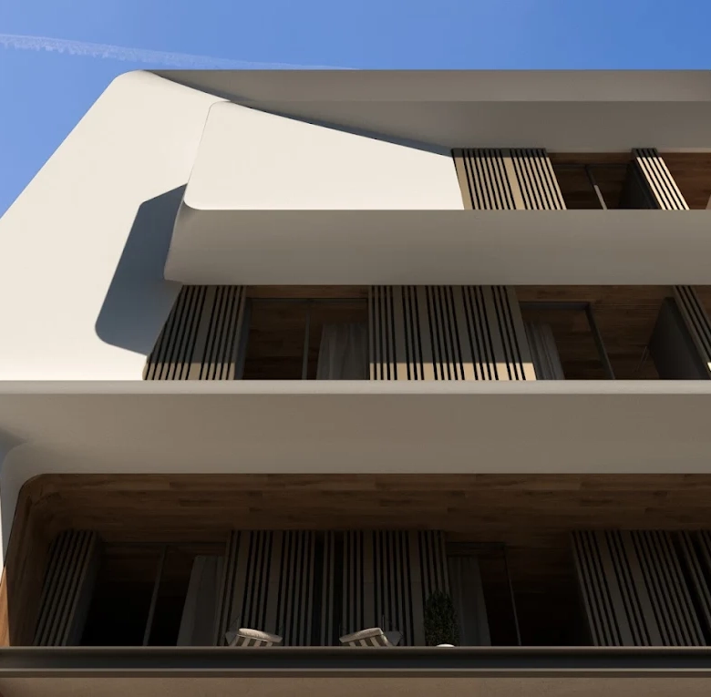 Upward exterior view of upper balconies and roofline of the Voula sea-view residence