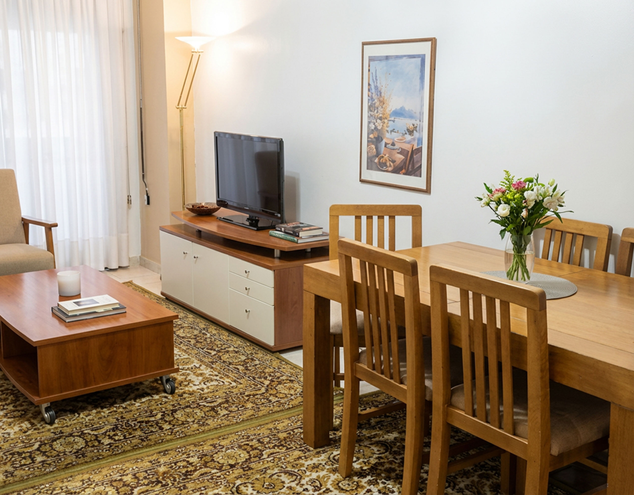 Living and dining area with TV console, dining table, and balcony door, Athens City Center, Greece