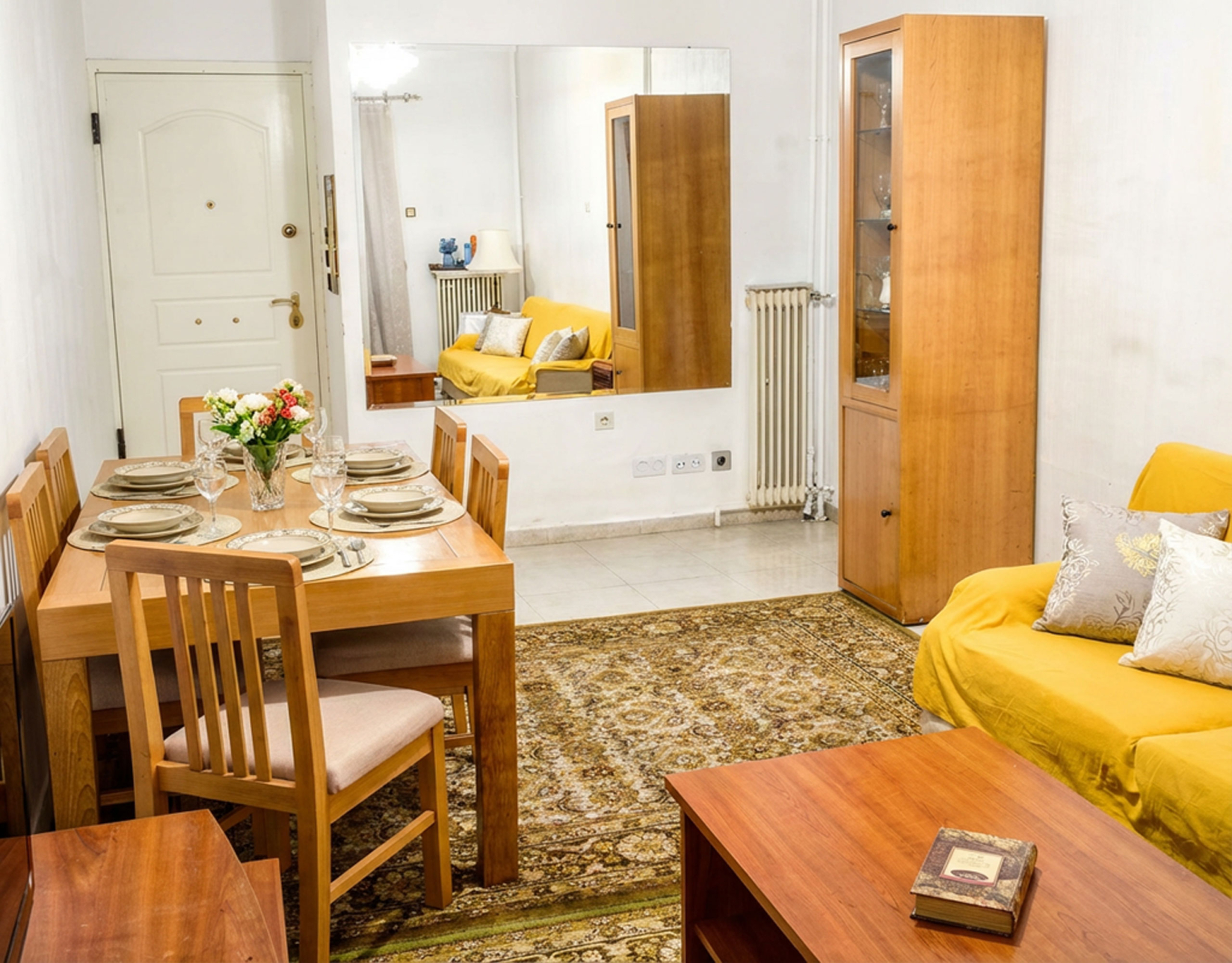 Open-plan living and dining area with sofa and dining table, Athens City Center, Greece
