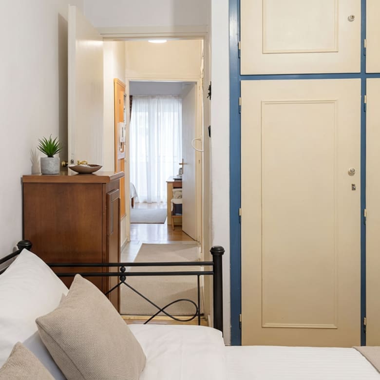 Bedroom corner with wardrobe doors and hallway view, Athens City Center, Greece