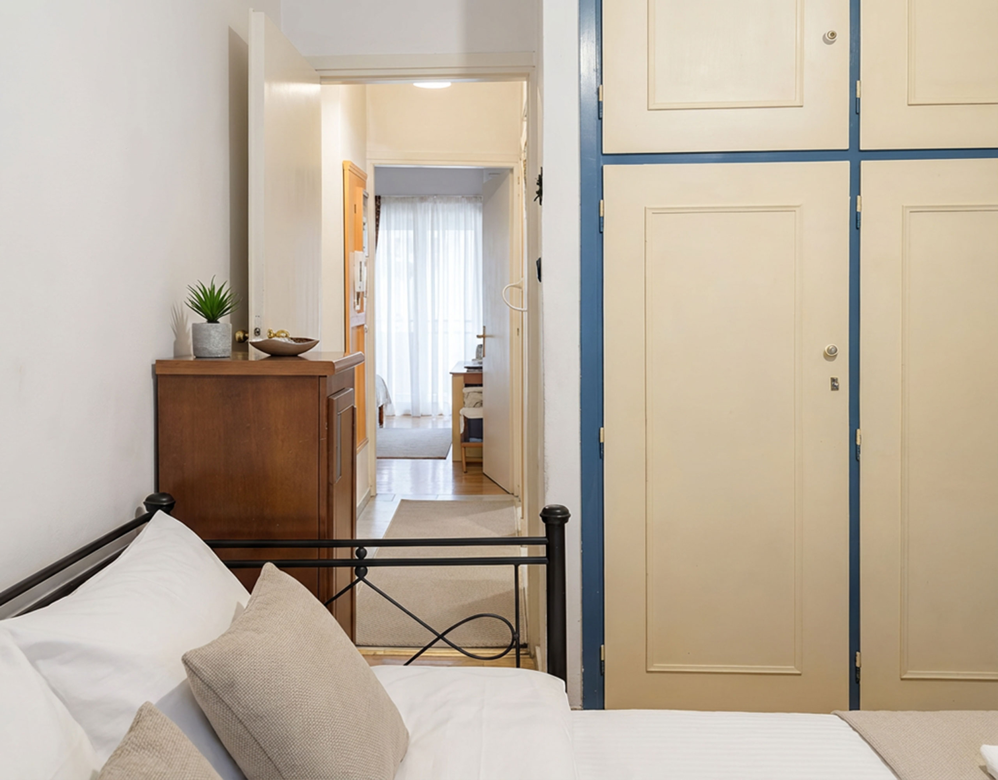 Bedroom corner with wardrobe doors and hallway view, Athens City Center, Greece