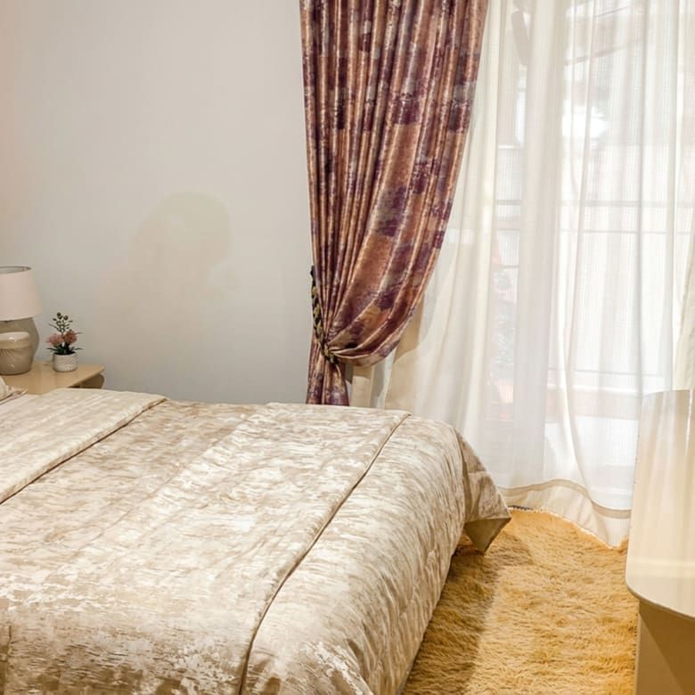 Bedroom with double bed and balcony door with curtains, Athens City Center, Greece