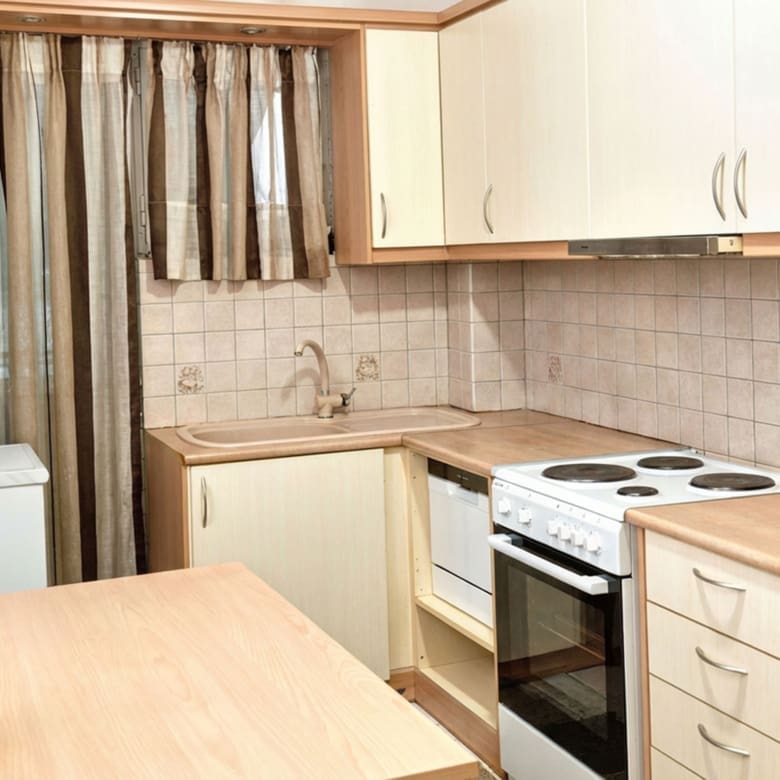 Compact kitchen with upper cabinets, stove, and countertop workspace, Athens City Center, Greece