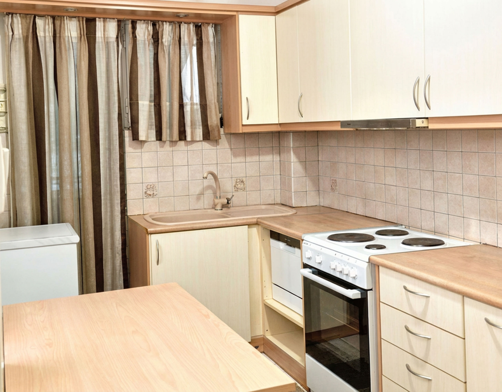 Compact kitchen with upper cabinets, stove, and countertop workspace, Athens City Center, Greece