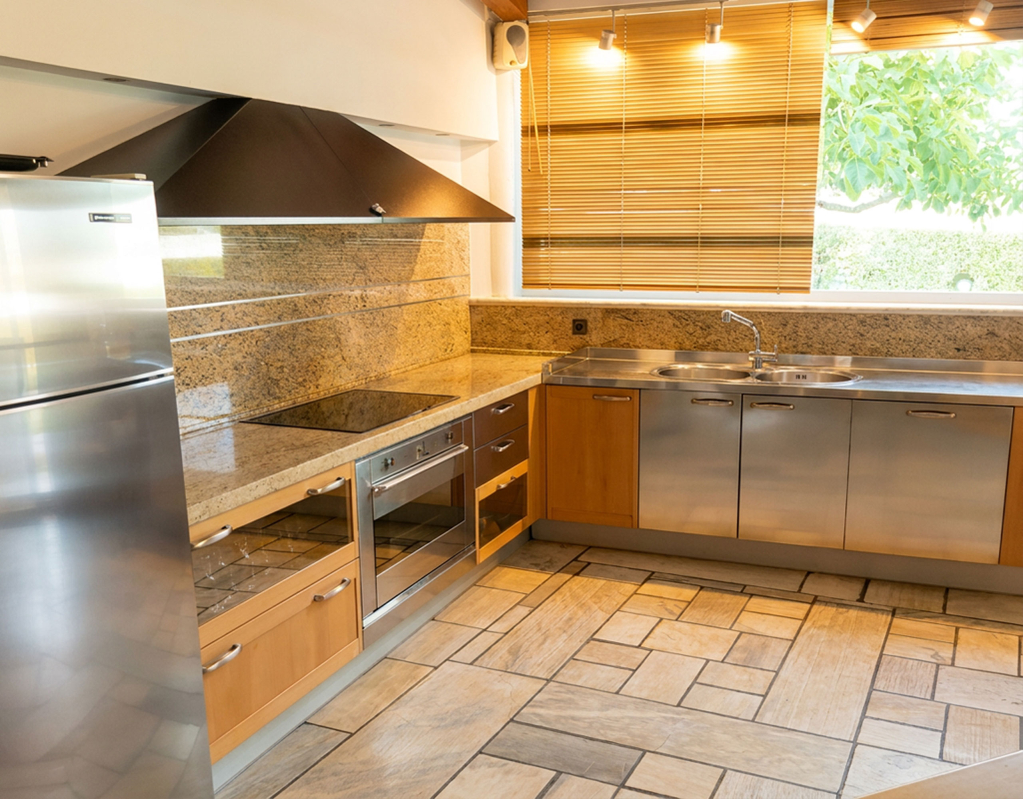 Porto Rafti Estate – Kitchen with Built-in Cabinetry Kitchen with built-in cabinetry and tiled finishes at a private estate in Porto Rafti, Attica