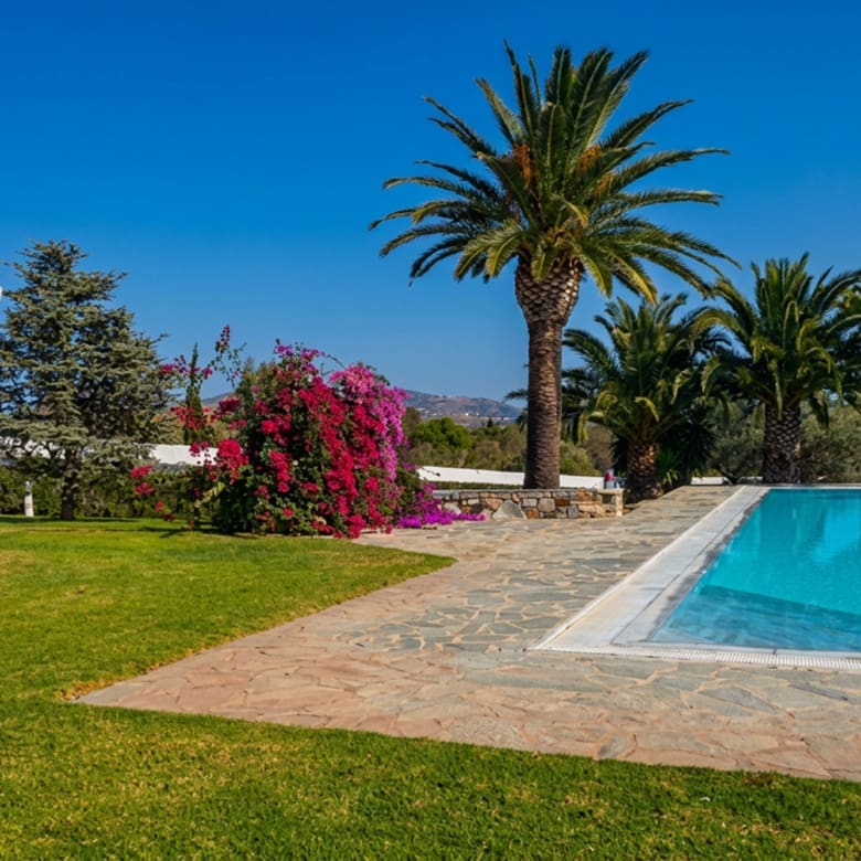 Garden lawn and poolside view at a private estate in Porto Rafti, Attica