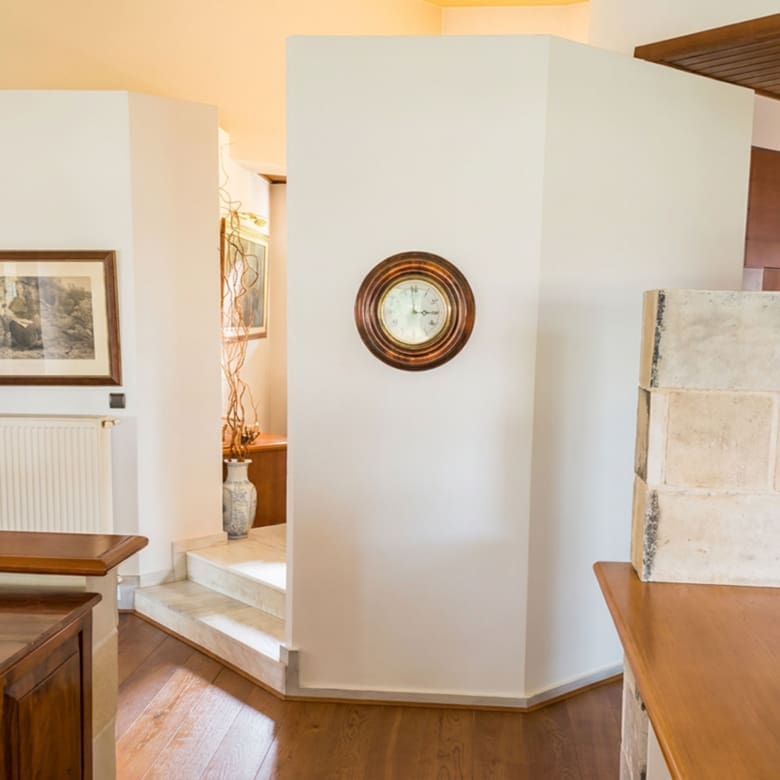 Interior detail with wall mirror and stone finish at the Porto Rafti private estate