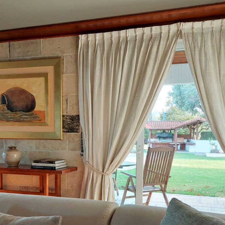 Interior window with curtains and garden outlook at the Porto Rafti private estate