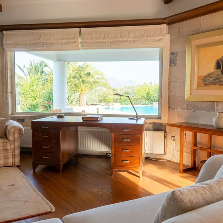 Living room with seating and garden view at a private estate in Porto Rafti, Attica