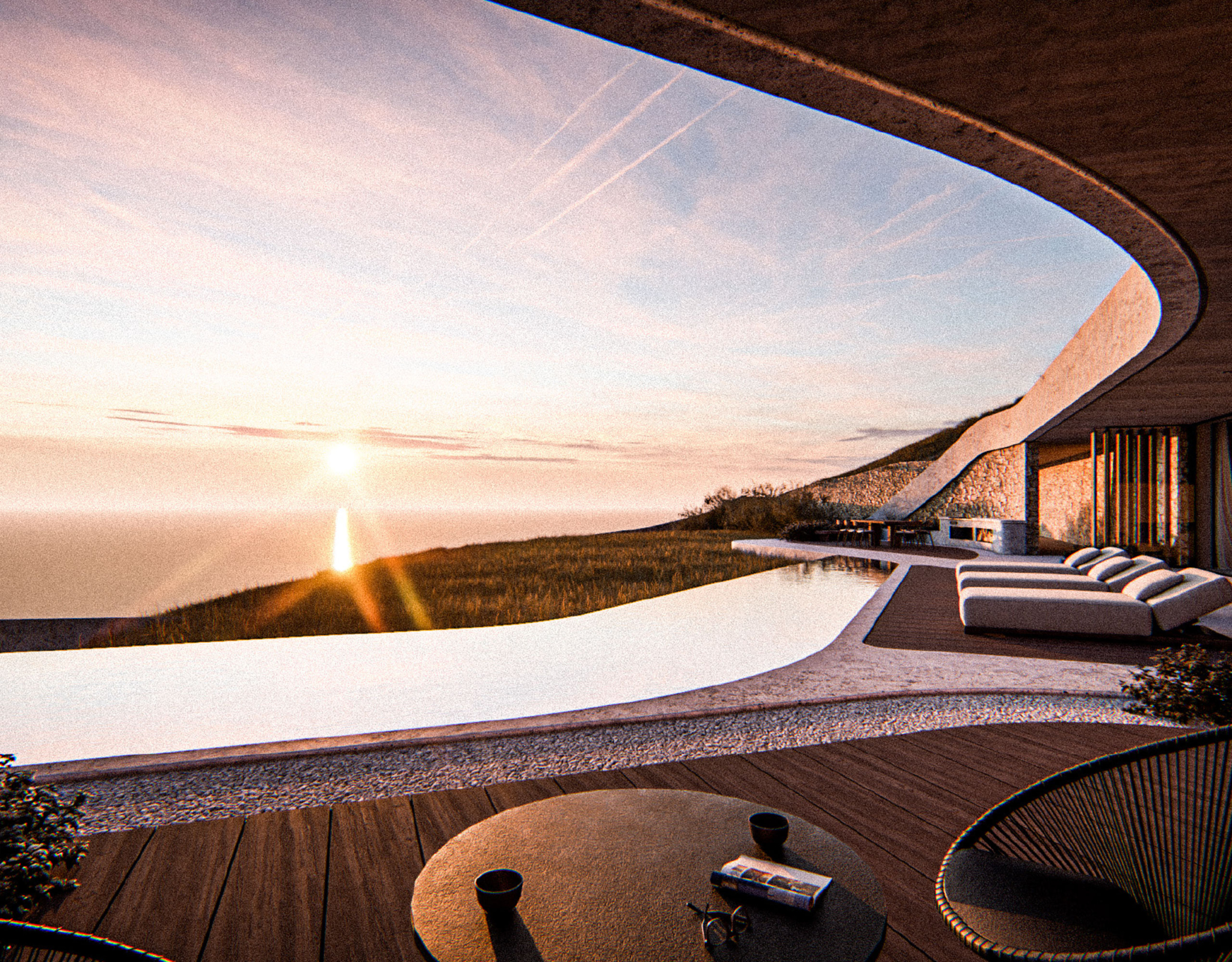 Sunset sea view from the curved outdoor terrace at Strokes of Tinos cave villas, Tinos, Cyclades