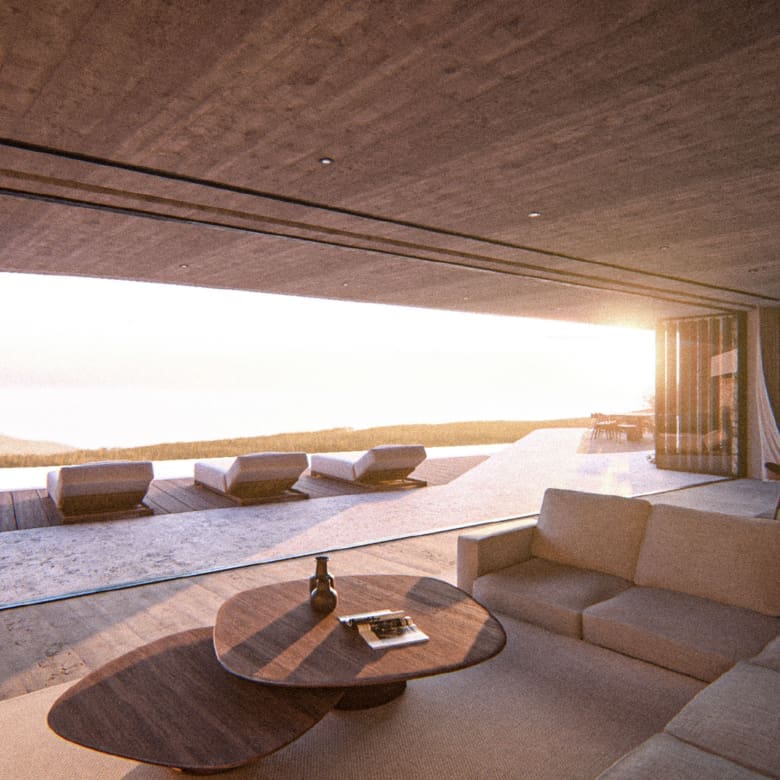 Outdoor lounge seating with sunset sea view at Strokes of Tinos luxury cave villas, Tinos, Cyclades