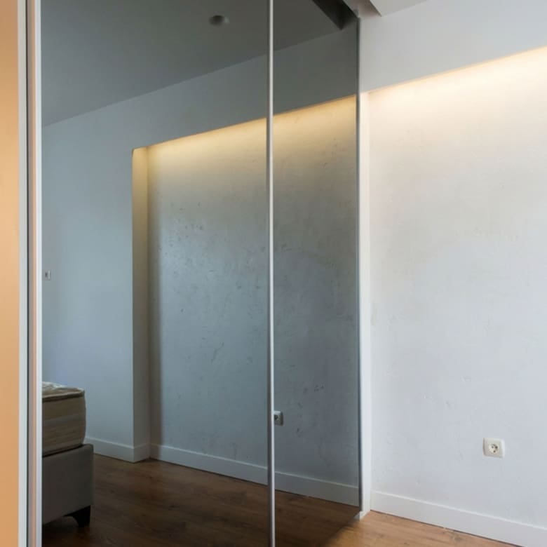 Bedroom with mirrored wardrobe doors and soft ambient lighting, Nea Filothei, Athens, Greece