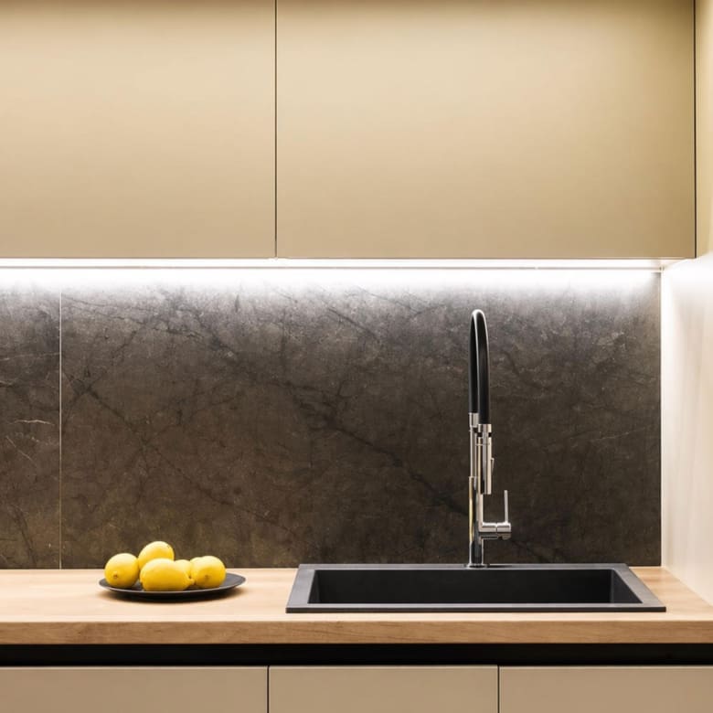 Kitchen sink and backsplash detail with under-cabinet lighting, Nea Filothei, Athens, Greece