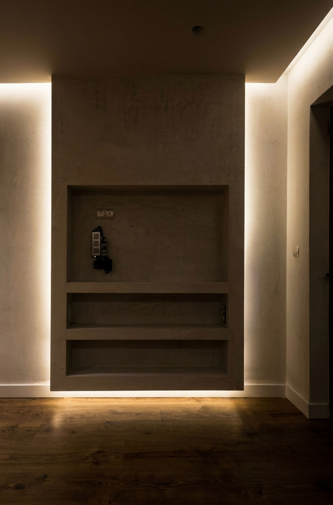 Minimal interior niche with recessed shelving and soft lighting, Nea Filothei, Athens, Greece