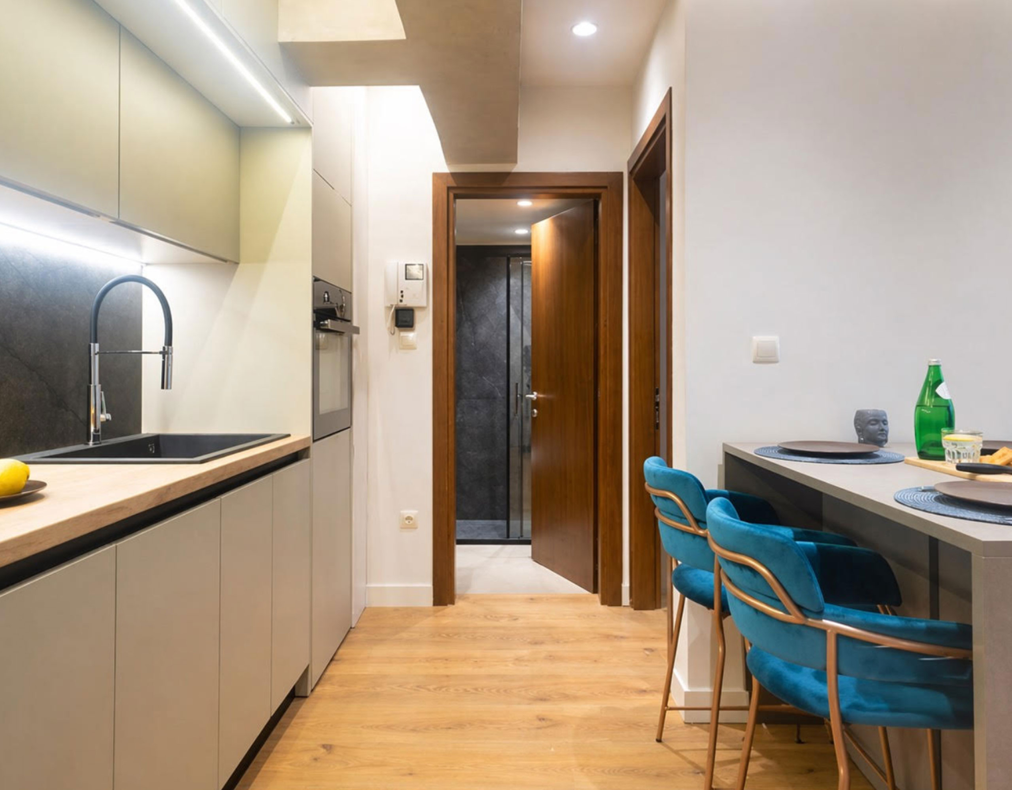 Open-plan kitchen and dining area with island seating and wood flooring, Nea Filothei, Athens, Greece